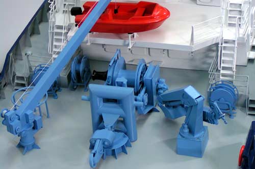 Scale model of tug Askold, aft towing winch and hook, cargo crane, boat and its davit